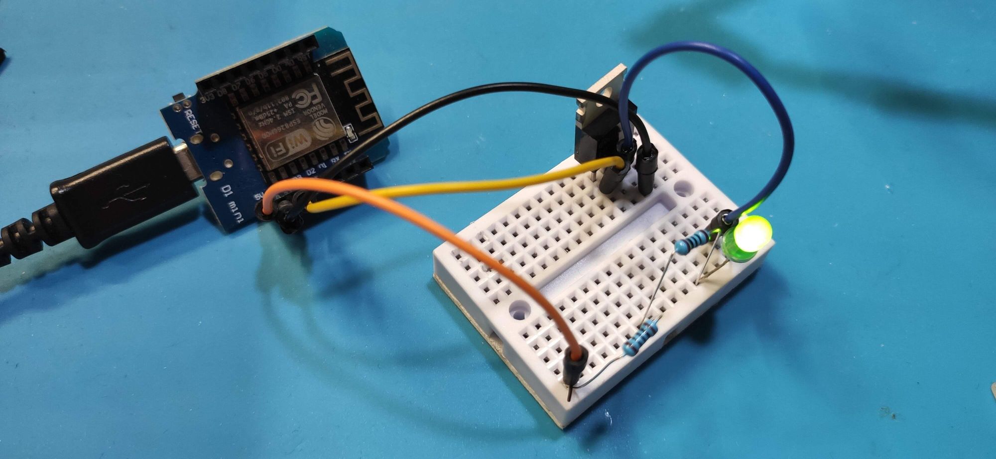 Prototype circuit using a breadboard and jumper wires.